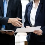 IT Consulting 2 professional business people workers working with 2024 07 16 00 55 16 utc min scaled e1733202659781